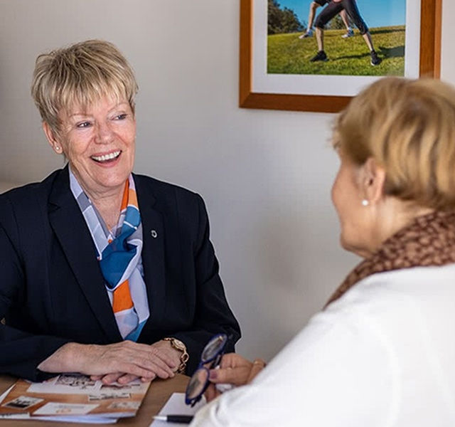 funeral director helping a woman