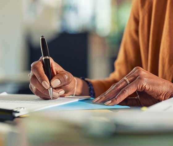 A person writing on paper