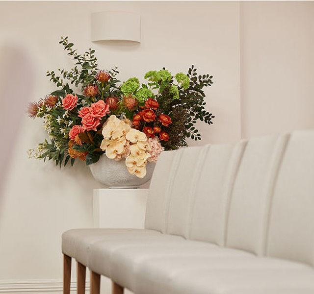 chairs and a floral arrangement
