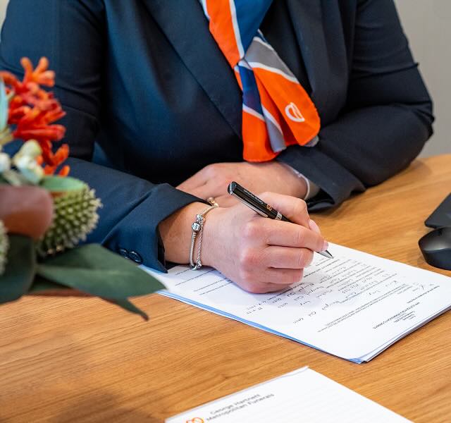 funeral director writing on paper
