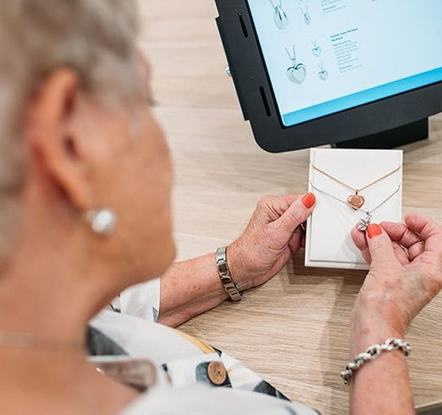 woman looking at jewellery