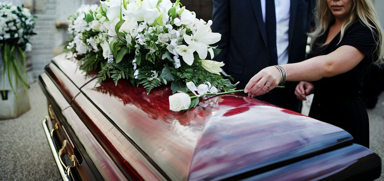 mourners with a coffin